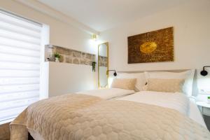 Postel nebo postele na pokoji v ubytování Luxury Lifestyle Rooms