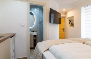 Postel nebo postele na pokoji v ubytování Luxury Lifestyle Rooms