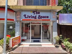 a store front with a sign for the living space at The Living Space in Lonavala