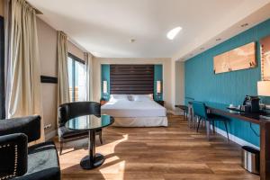 Postel nebo postele na pokoji v ubytování Pestana Arena Barcelona + 46 fotografií