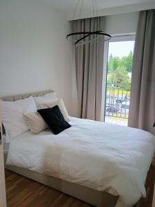 מיטה או מיטות בחדר ב-Apartamenty Cieszyn