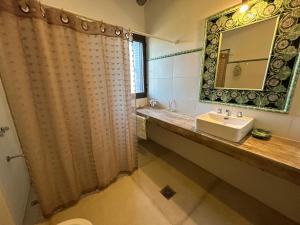 a bathroom with a sink and a mirror at Casita de ensueño Andes Crucecita in Las Compuertas +69 photos