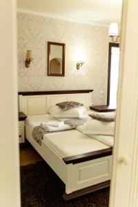 two beds in a room with a mirror at Green Garden Avrig in Avrig +94 photos