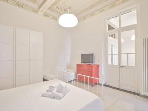 Postel nebo postele na pokoji v ubytování Medusa Apartment - Affresco