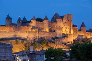 a large castle sitting on top of a hill at la maison bel air in Limoux