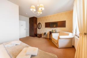 Posteľ alebo postele v izbe v ubytovaní Hotel Plumlov