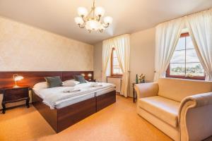 Posteľ alebo postele v izbe v ubytovaní Hotel Plumlov