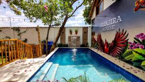 a swimming pool in front of a building at Guajira House in Ríohacha