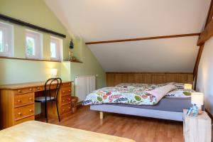 Postel nebo postele na pokoji v ubytování Gîte La Ramée
