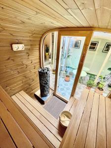 a wooden interior of a sauna with a window at Boutique B&B Graaf in Ghent