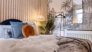 Ένα ή περισσότερα κρεβάτια σε δωμάτιο στο London Hammersmith - hot tub, cinema & gaming room