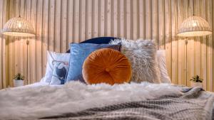 Ένα ή περισσότερα κρεβάτια σε δωμάτιο στο London Hammersmith - hot tub, cinema & gaming room