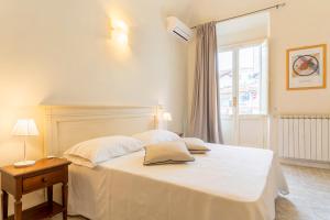 Postel nebo postele na pokoji v ubytování Hotel Corallo