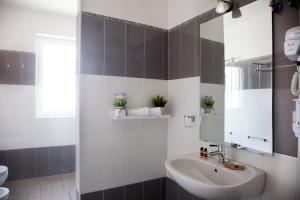 Koupelna v ubytování Aparthotel Le Marine