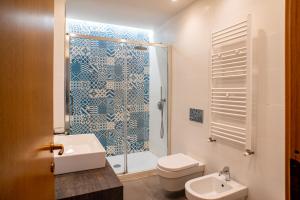 a bathroom with a shower and a toilet and a sink at Monterosso view apartment 5 Terre in Monterosso al Mare