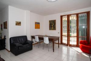 a living room with a table and a chair at Monterosso view apartment 5 Terre in Monterosso al Mare