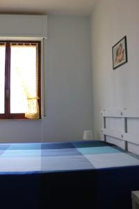 Postel nebo postele na pokoji v ubytování Appartamento Stella Di Mare