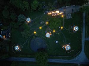 an overhead view of a park at night with lights at Glamp and Tipple Ltd in Great Ellingham