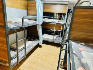 Palanda nebo palandy na pokoji v ubytování 安家青年寓舍深圳北站店Anjia Youth Hostel Shenzhen Railway North Branch