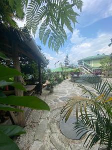 a garden with a stone walkway with a roof at 18 Soesunn in Māngwa