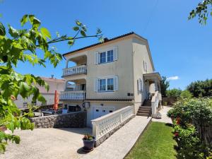 a villa with a view of the house at Apartment Danica in Malinska