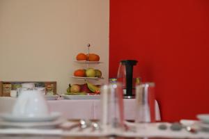 a kitchen with a counter with fruits on shelves at Casa Vale do Douro in Mesão Frio