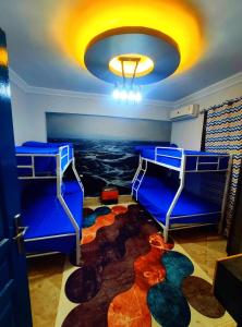 a room with two bunk beds and a rug at Blue Bay Asia Sokhna Aqua Park for rent O o in Ain Sokhna