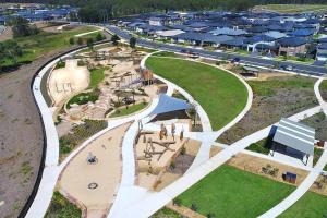 an aerial view of a park with a playground at Aircabin - Denham Court - Modern - 4 Beds House in Leppington