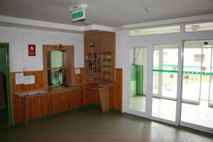an empty room with a glass door and a counter at ŠD Jedlíkova 5 in Košice