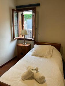 a bedroom with a bed with a towel on it at Casa Rural El Chorrito in Buenavista del Norte