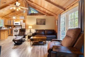 a living room with a couch and a table at The Eldon Cabin Experience in Eldon