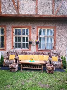 a couch sitting in front of a building with windows at Raudtee in Viljandi
