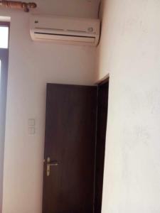 a brown door in a room with a ceiling at house FYNTIKAKH - SKALA in Anopoli Sfakion