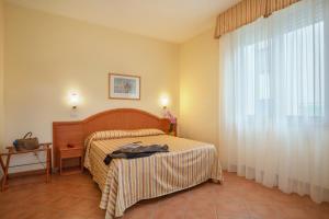 Posteľ alebo postele v izbe v ubytovaní Hotel Katy