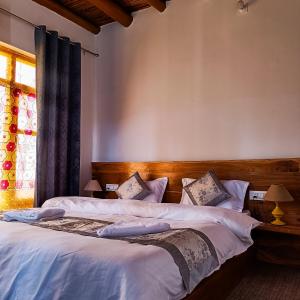 Ένα ή περισσότερα κρεβάτια σε δωμάτιο στο TRAVELLER NEST +14 φωτογραφίες
