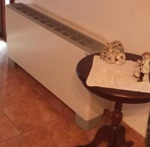 a counter with a stool in front of a wall at house FYNTIKAKH - SKALA in Anopoli Sfakion