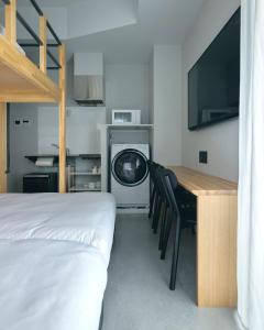 A kitchen or kitchenette at da Haus Shinjuku