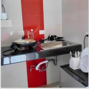 a kitchen with a sink and a counter top at Departamentos Villas Capdeviel in Cancún