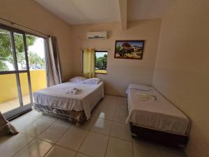 Ένα ή περισσότερα κρεβάτια σε δωμάτιο στο HOTEL E RESTAURANTE ILHA BELA