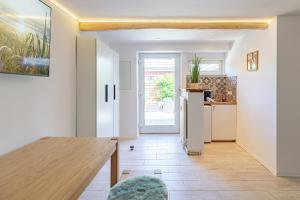 Η κουζίνα ή μικρή κουζίνα στο Ferienwohnung Kleiner Sandloper