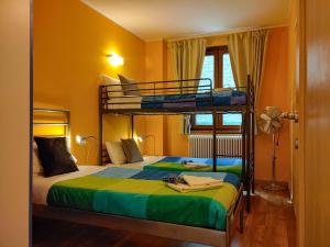 a bedroom with two bunk beds in a room at Casa Mattia in Sorico