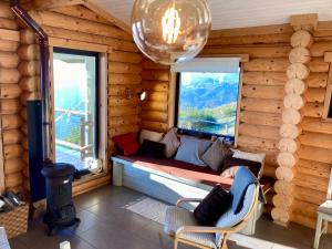 a room with a bench in a log cabin with a window at Mountain Log Cabin O Garrano in Cabeceiras de Basto +59 photos