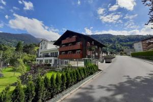 a house on the side of a road next to a street at Drei Türme Top A1 in Schruns-Tschagguns