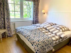 Ένα ή περισσότερα κρεβάτια σε δωμάτιο στο Remise Anker links