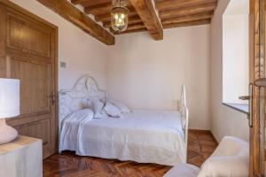 Postel nebo postele na pokoji v ubytování Casa Bachella
