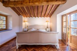 Postel nebo postele na pokoji v ubytování Casa Bachella