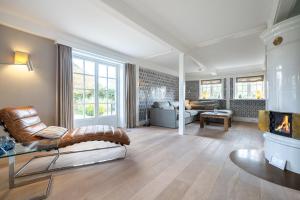 a large living room with a couch and a table at Victoria in Keitum