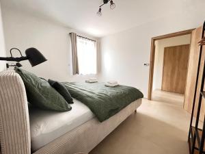 Postel nebo postele na pokoji v ubytování Apartmány Mušlov