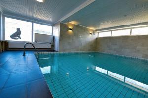 a large swimming pool with a pool at Haus Seehund HD04 in Cuxhaven