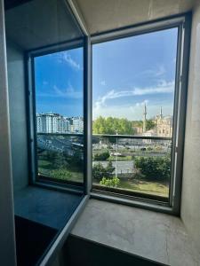 a window with a view of a city at Aram Edessa Hotel in Istanbul